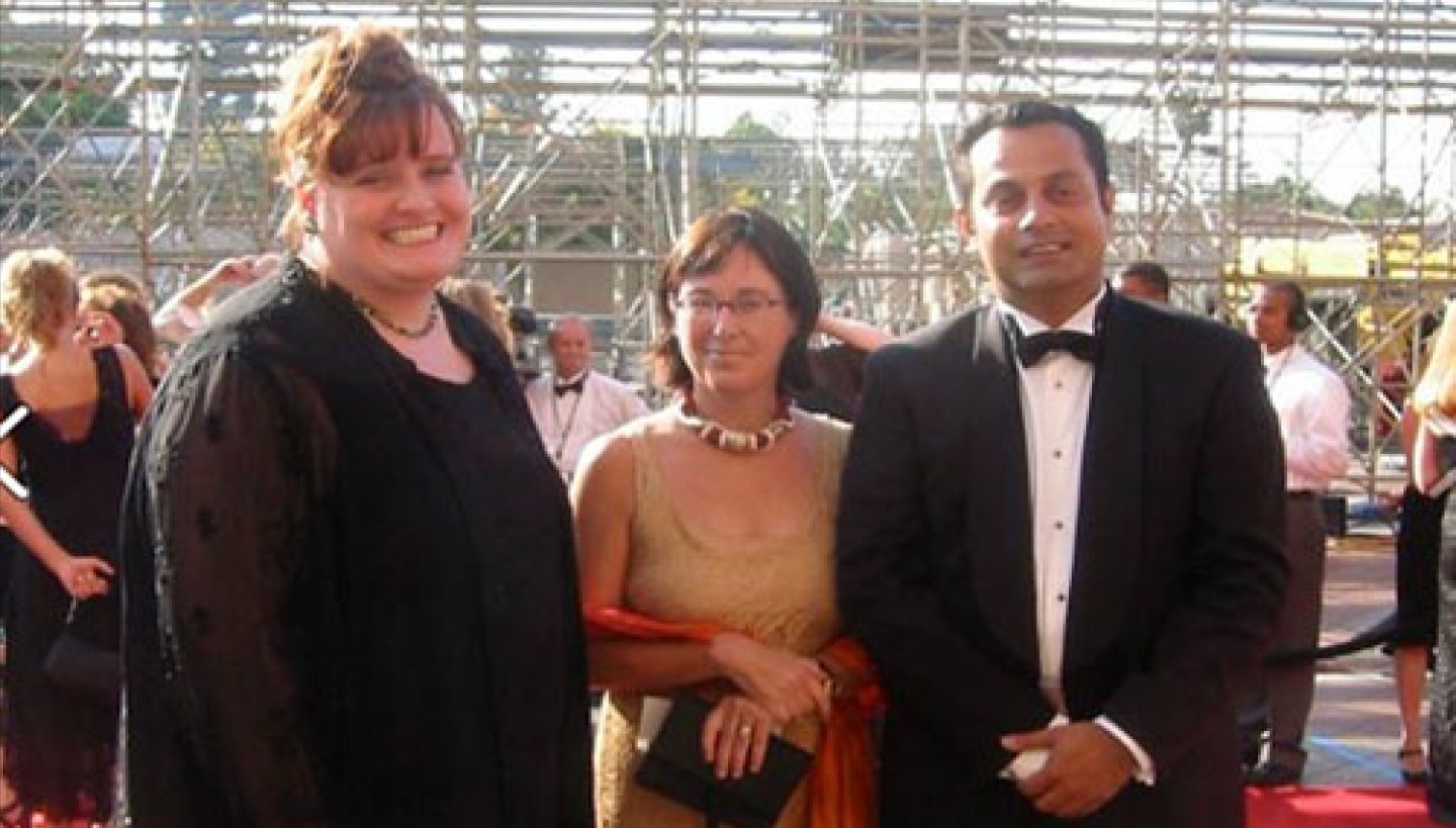 Ahmer Kalam on a red carpet with colleagues