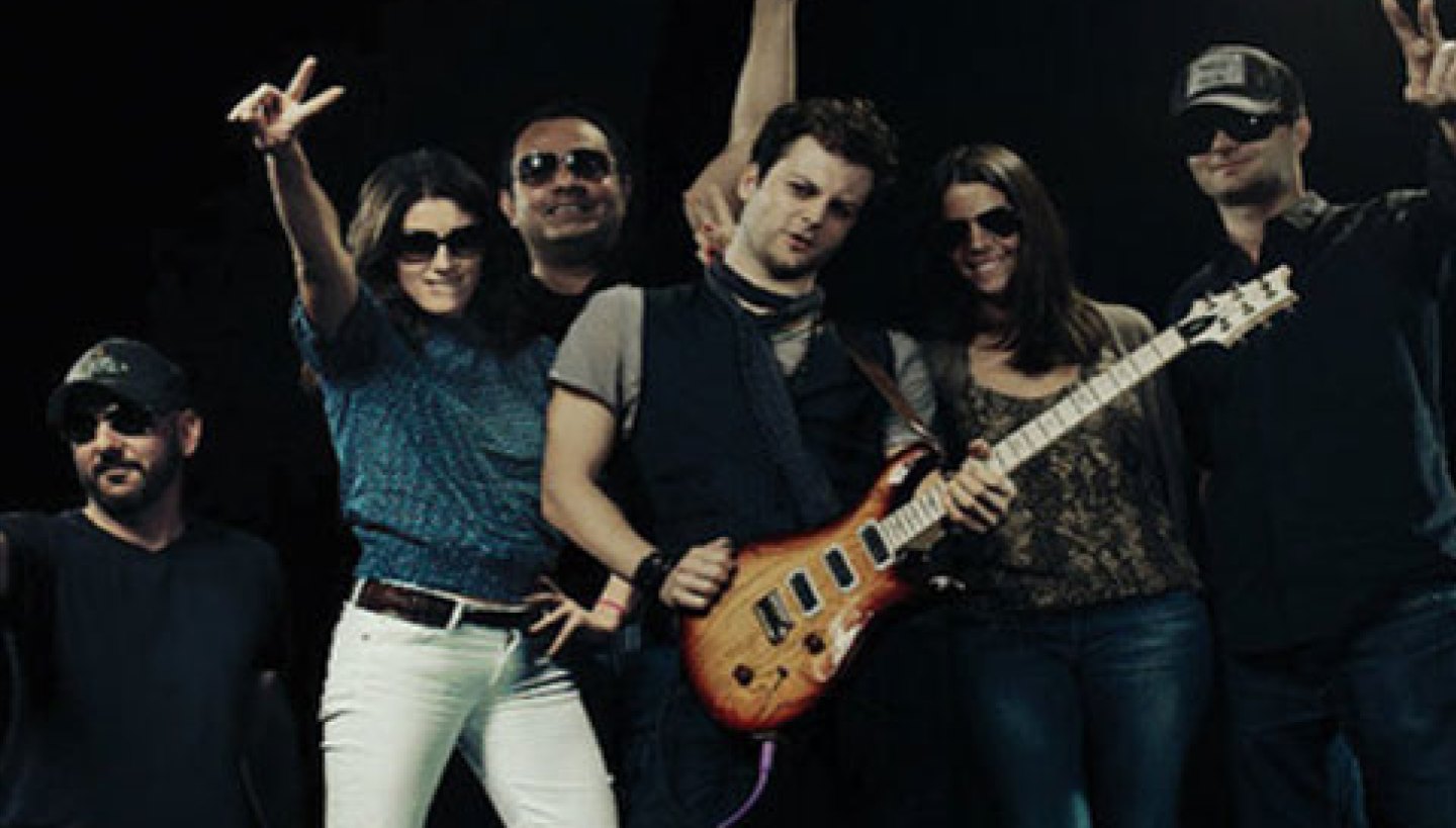 Ahmer Kalam with a band on stage