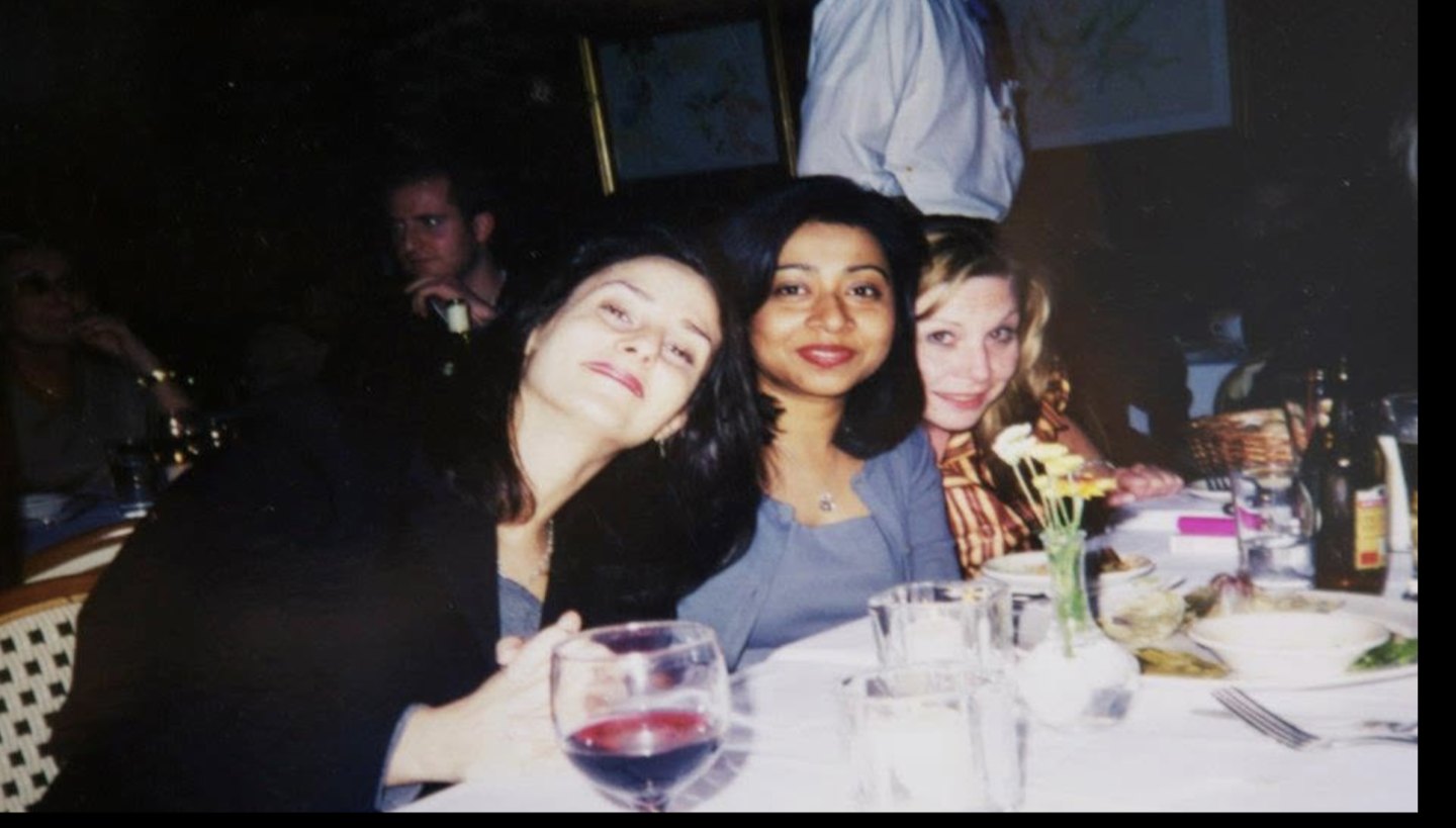 Ahmer Kalam with friends at a dinner table