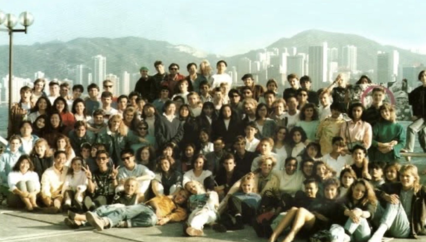 Ahmer Kalam in a large group photo outdoors