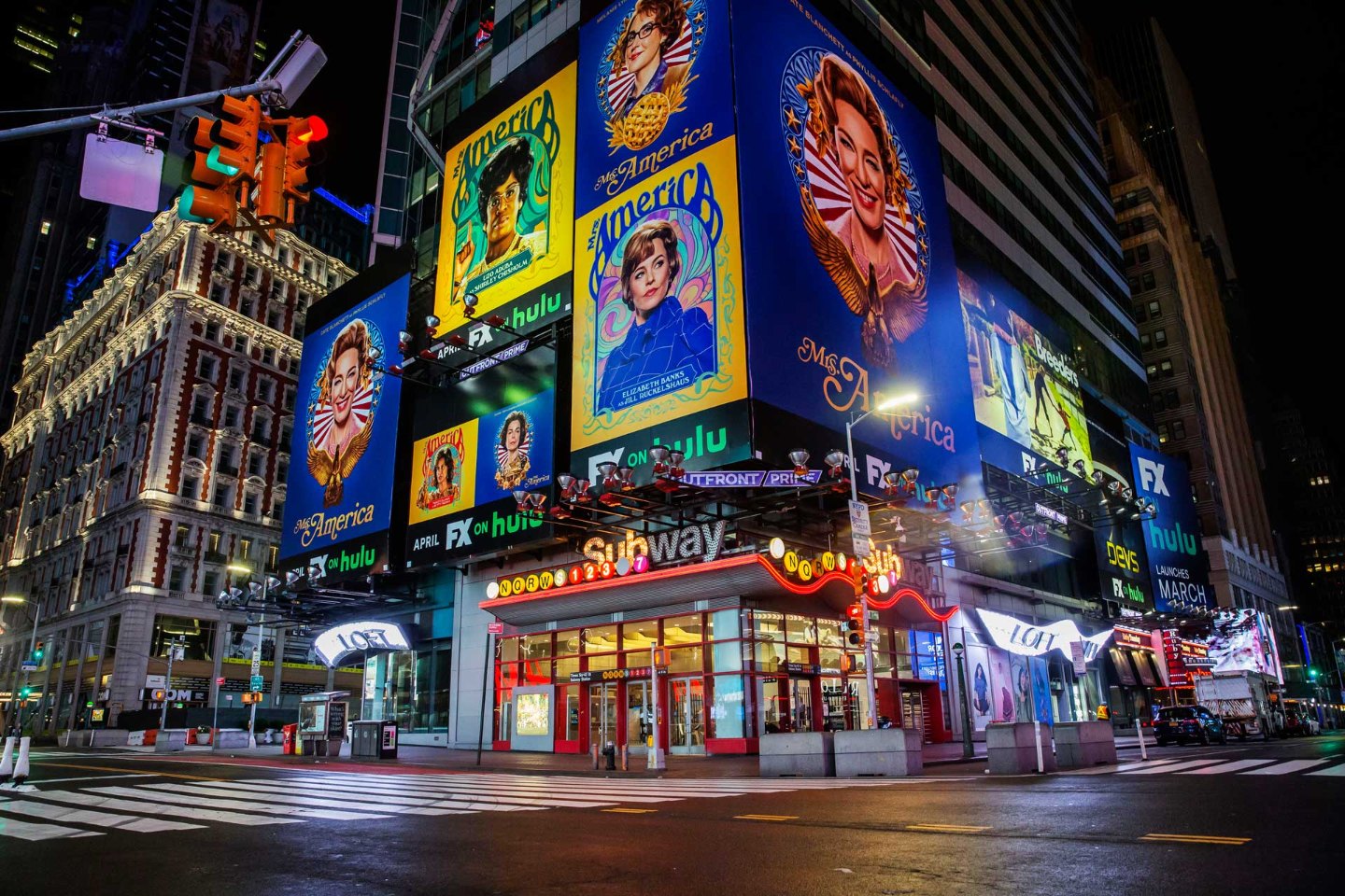 An empty Times Square at night — photograph by Ahmer Kalam